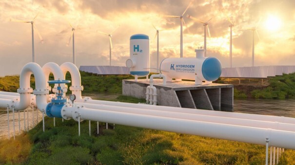 Hydrogen production facility with industrial pipelines and storage tanks.